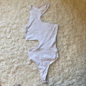 Asymmetrical white rib knit bodysuit with side cutout